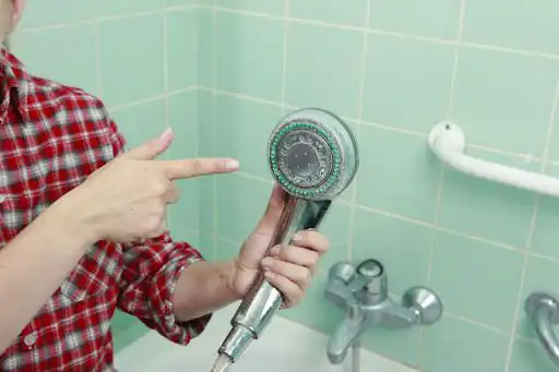 pointing at showerhead